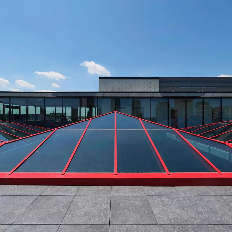 KlearSky™ custom glass pyramid skylight with red aluminum finished framing
