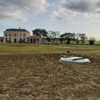 The new house and the BioDisc cover in the field