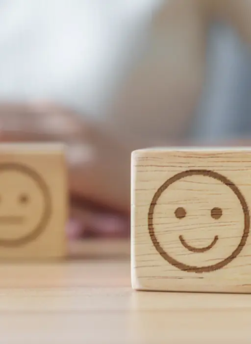 Wooden block with smiling emoji