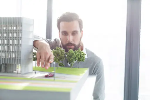 Businessman-at-building-model