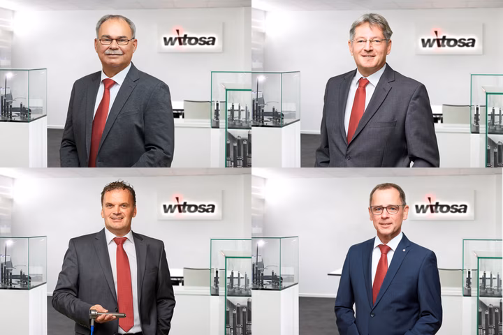 Four men in suits pose in separate frames in an office lobby with the "Witosa" logo visible in the background.