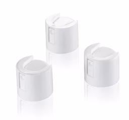 Three white, cylindrical spray can nozzles with rounded tops on a reflective surface, arranged in a triangular pattern.