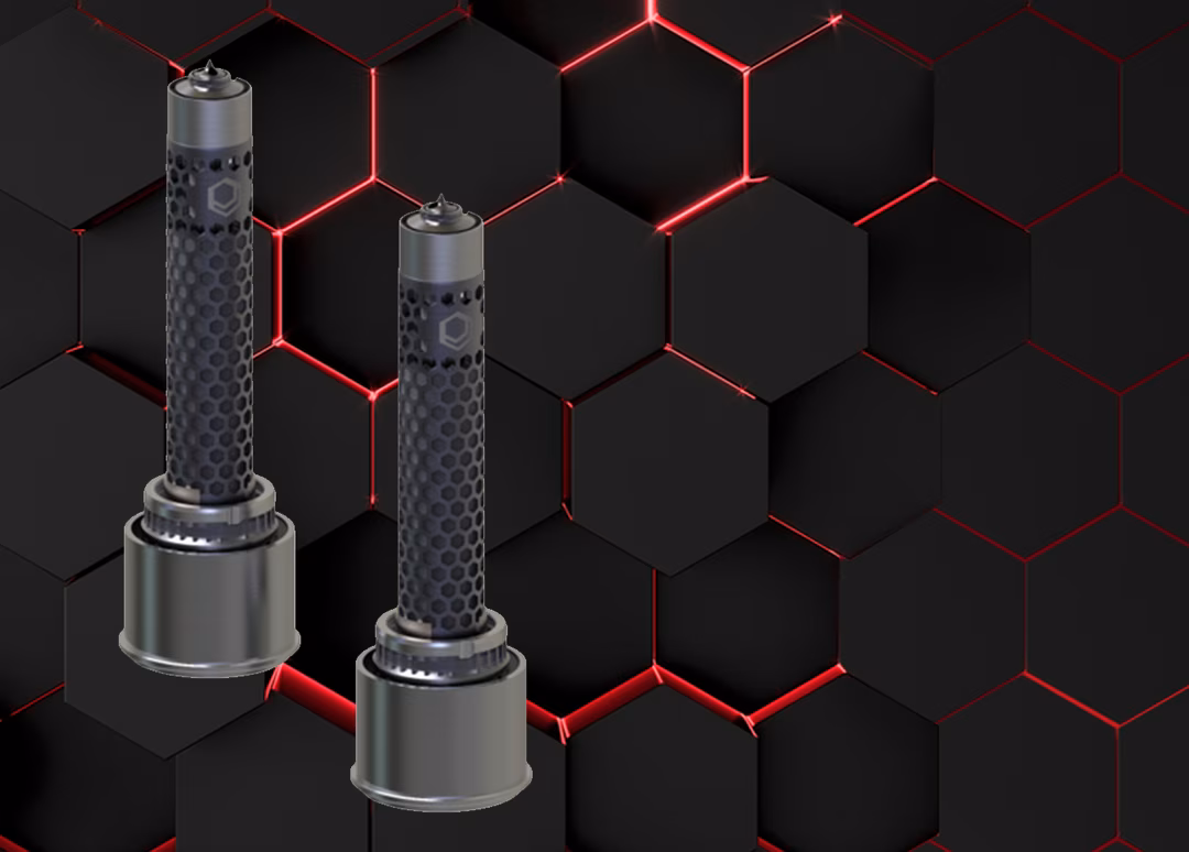 Two cylindrical metal objects with black perforated covers on a dark hexagonal pattern background with red highlights.