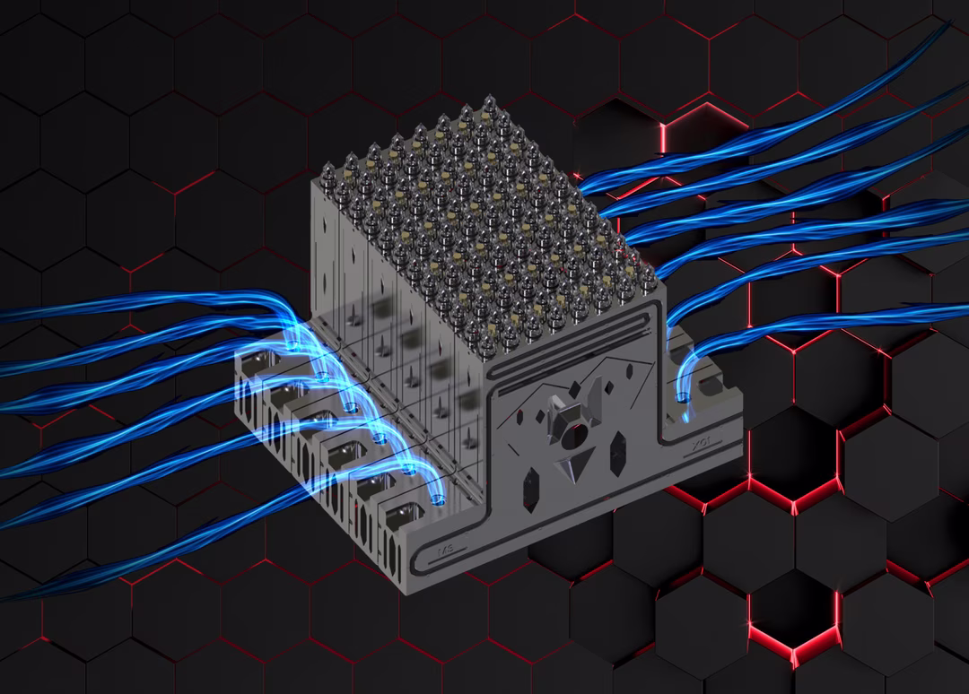 Metallic device with multiple connectors and blue cables, set against a black and red hexagonal pattern background.