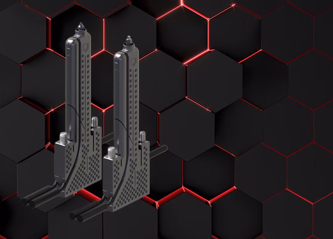 Two metallic cooling towers with perforated sides on a black hexagonal background with red glowing lines.