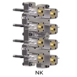 A complex mechanical assembly with metallic and brass components, featuring multiple connectors and cylindrical parts arranged vertically.