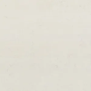 Cream-colored textured marble surface with subtle veining and speckles, creating a natural, elegant pattern.