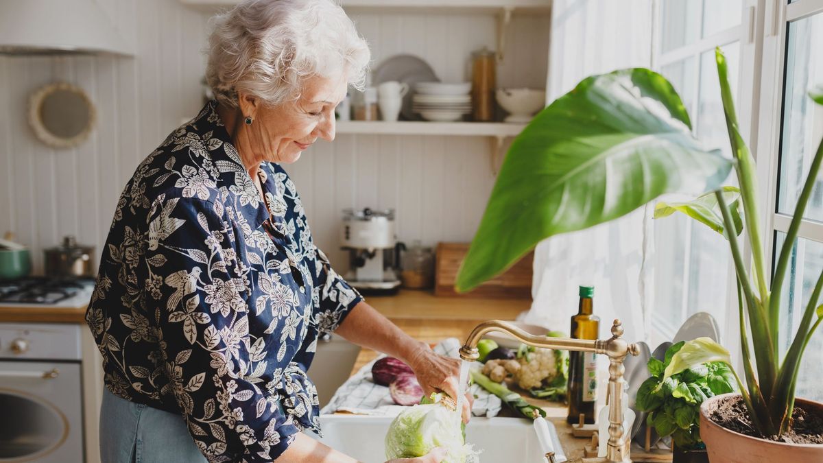 Woman 60 and up making healthy food