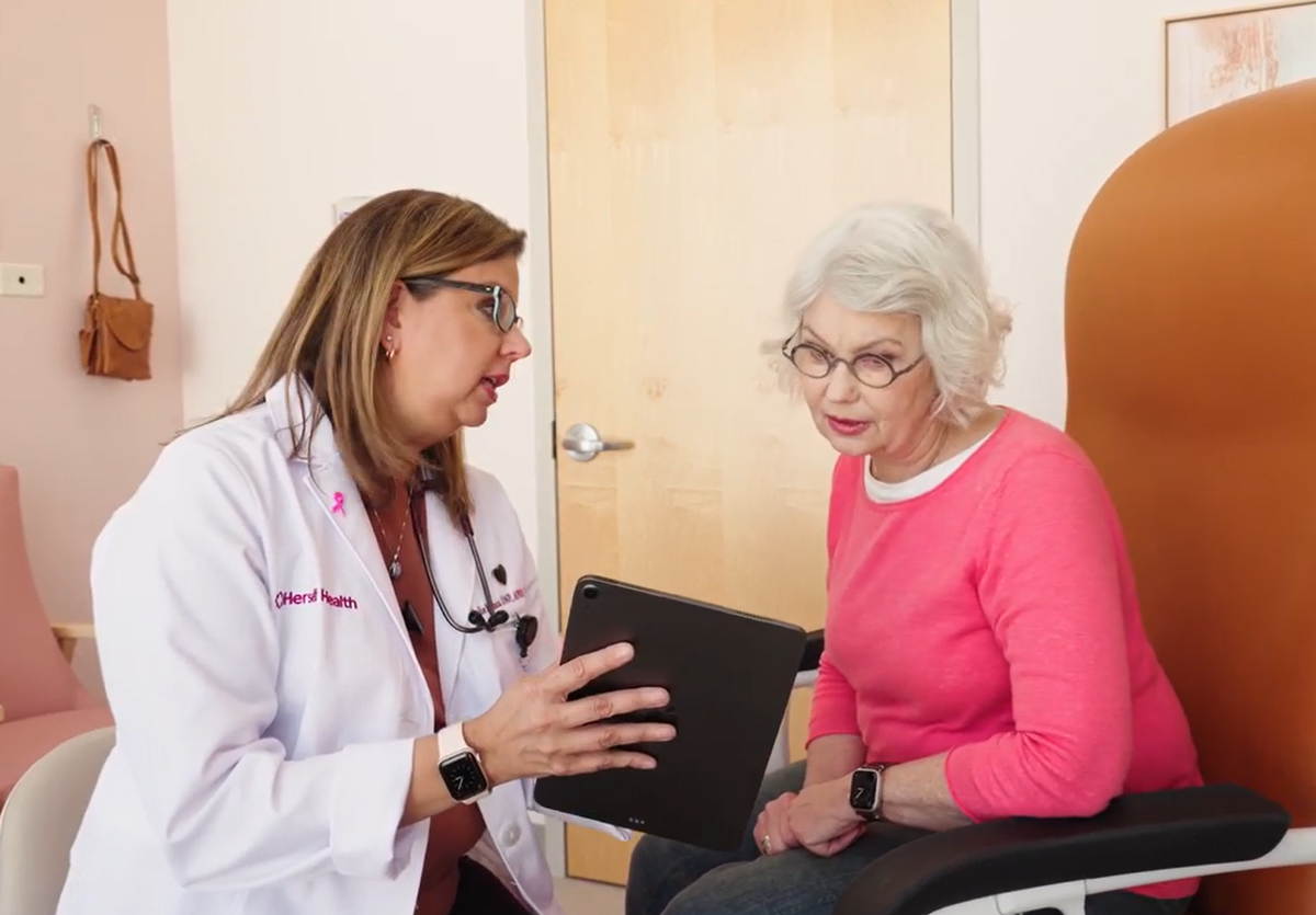 Herself Health provider talking to female 65+ patient