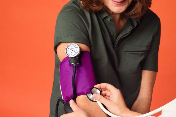 Woman having her blood pressure taken by provider