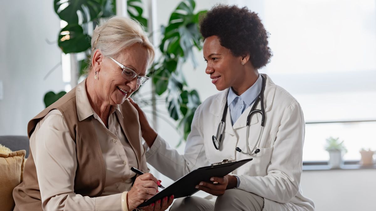 Provider helping patient with vitamins