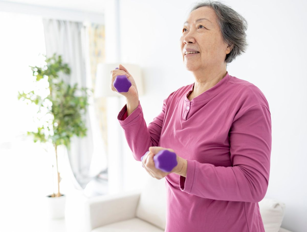Women using weights to strengthen bones
