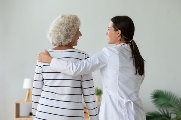 Provider leading patient back to appointment room