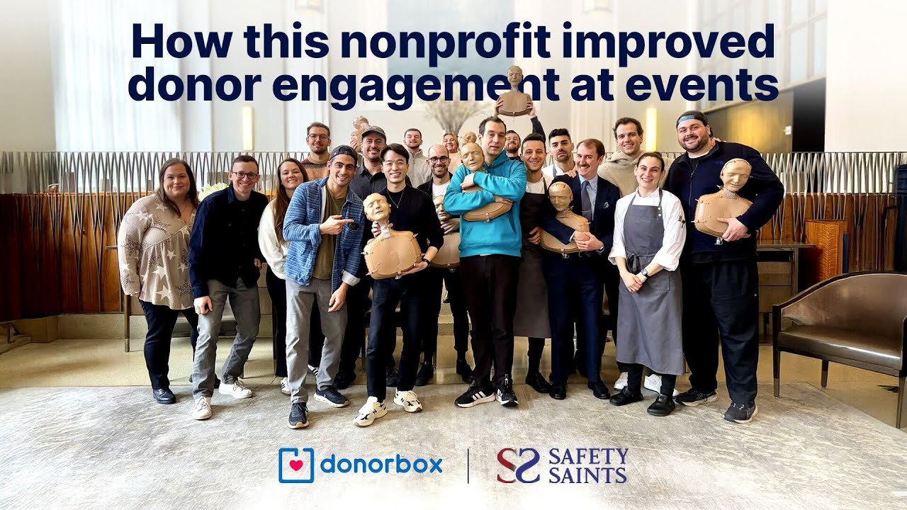 Group of people holding CPR mannequins at a Safety Saints nonprofit event, with Donorbox branding and text about improving donor engagement.