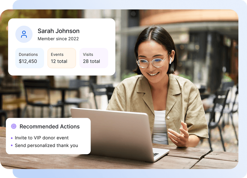 A woman with glasses using a laptop, viewing donation stats and recommended actions like inviting to events and sending thank you notes.