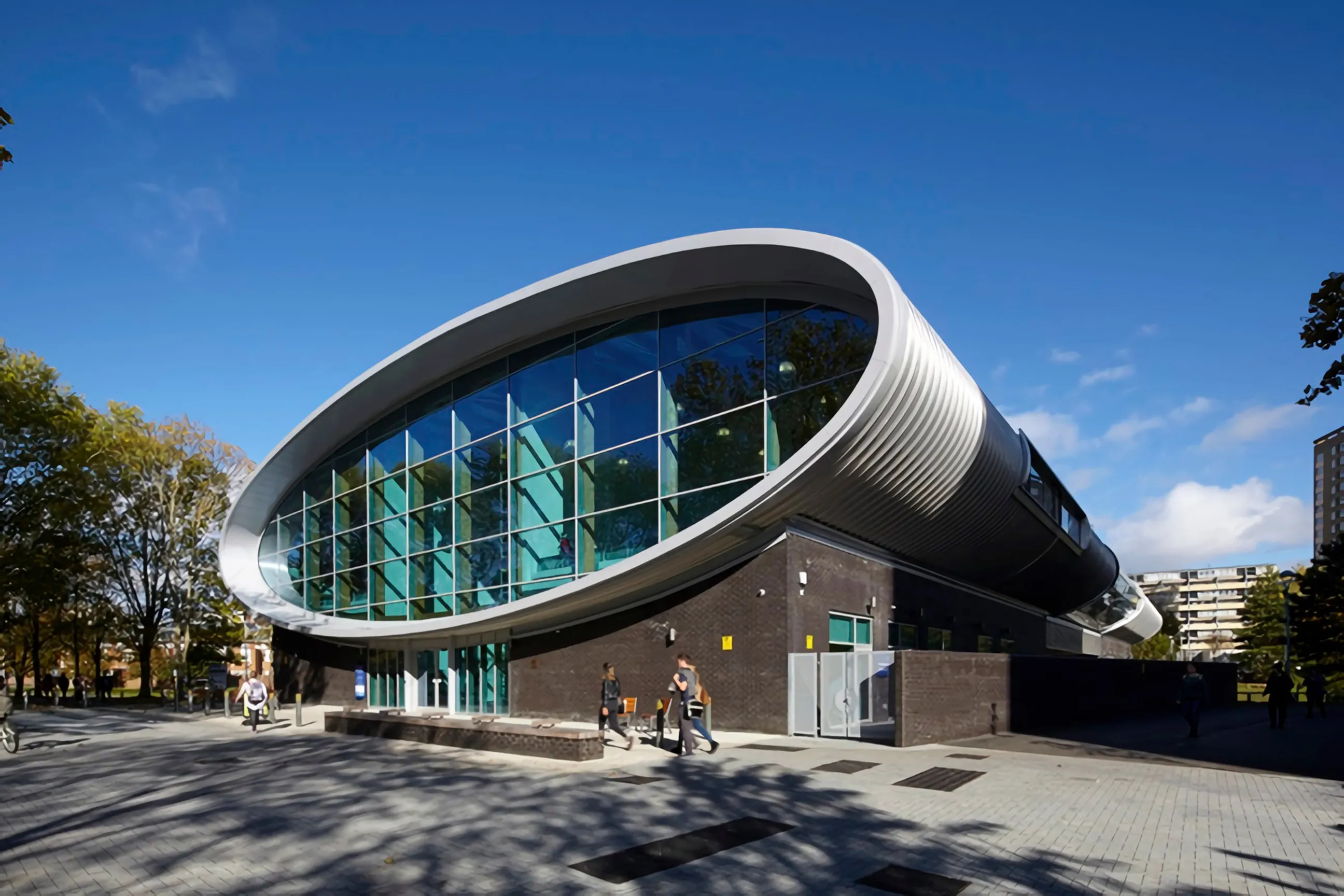 Modern elliptical building with glass facade