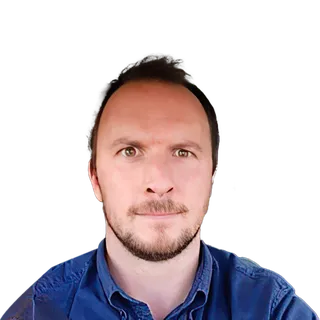 Man with beard in blue shirt