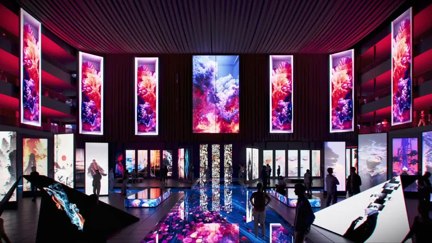 Futuristic exhibition space with vibrant digital screens displaying colorful abstract art, reflecting on shiny floors and surrounded by silhouettes of people.