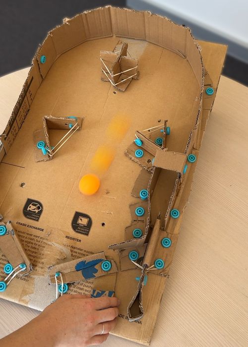 Cardboard Makedo pinball arcade game firing a ping-pong ball