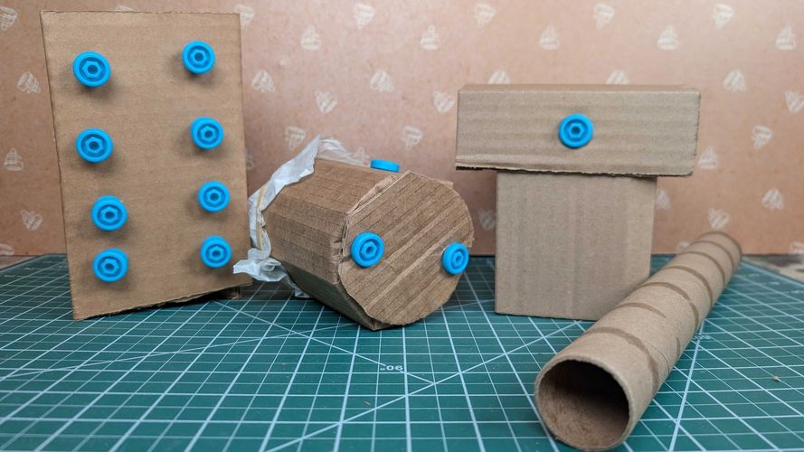 DIY cardboard musical instrument shapes made using Makedo Scru connectors