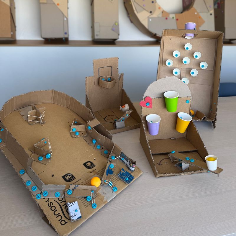 Four cardboard table-top arcade games made with Makedo