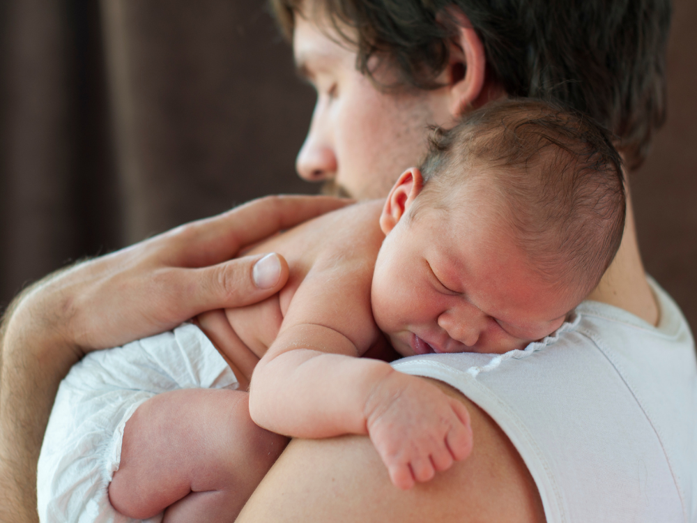 dad holding baby