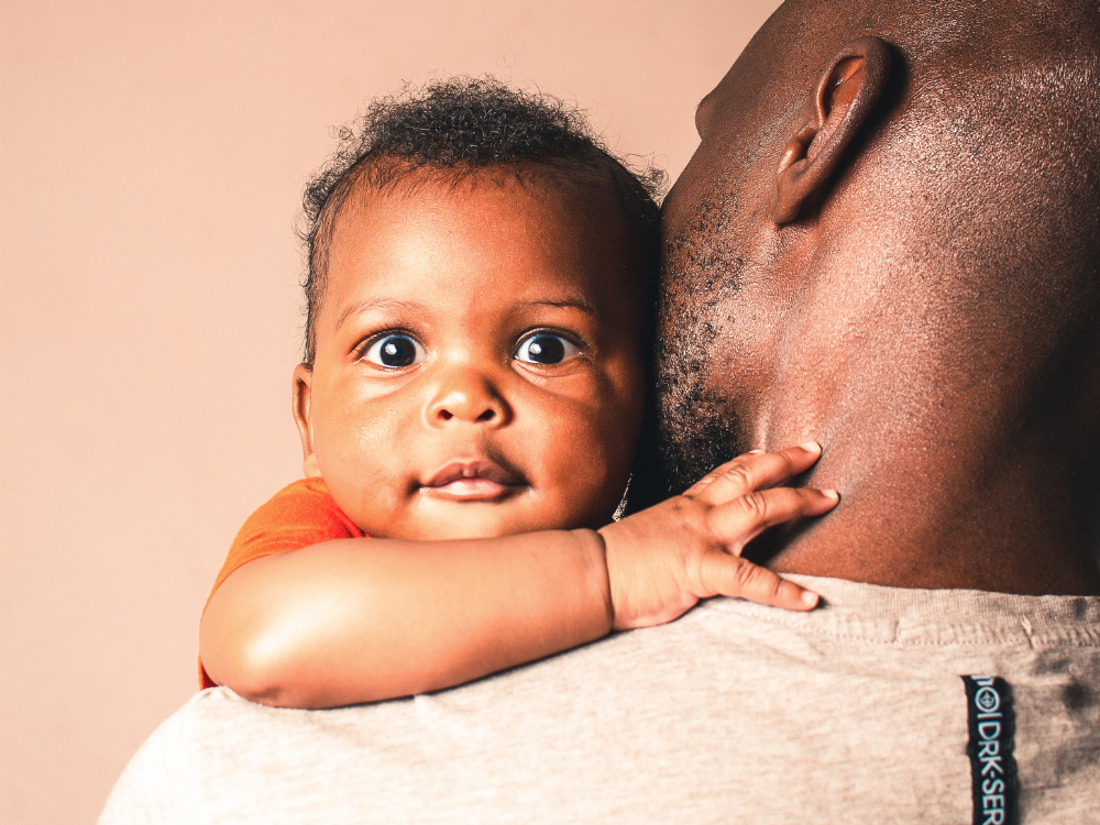 father holding baby