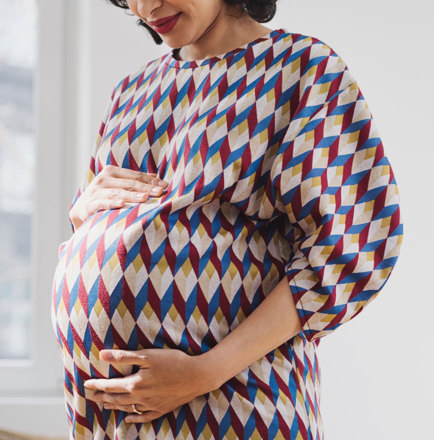 Expectant mother smiling