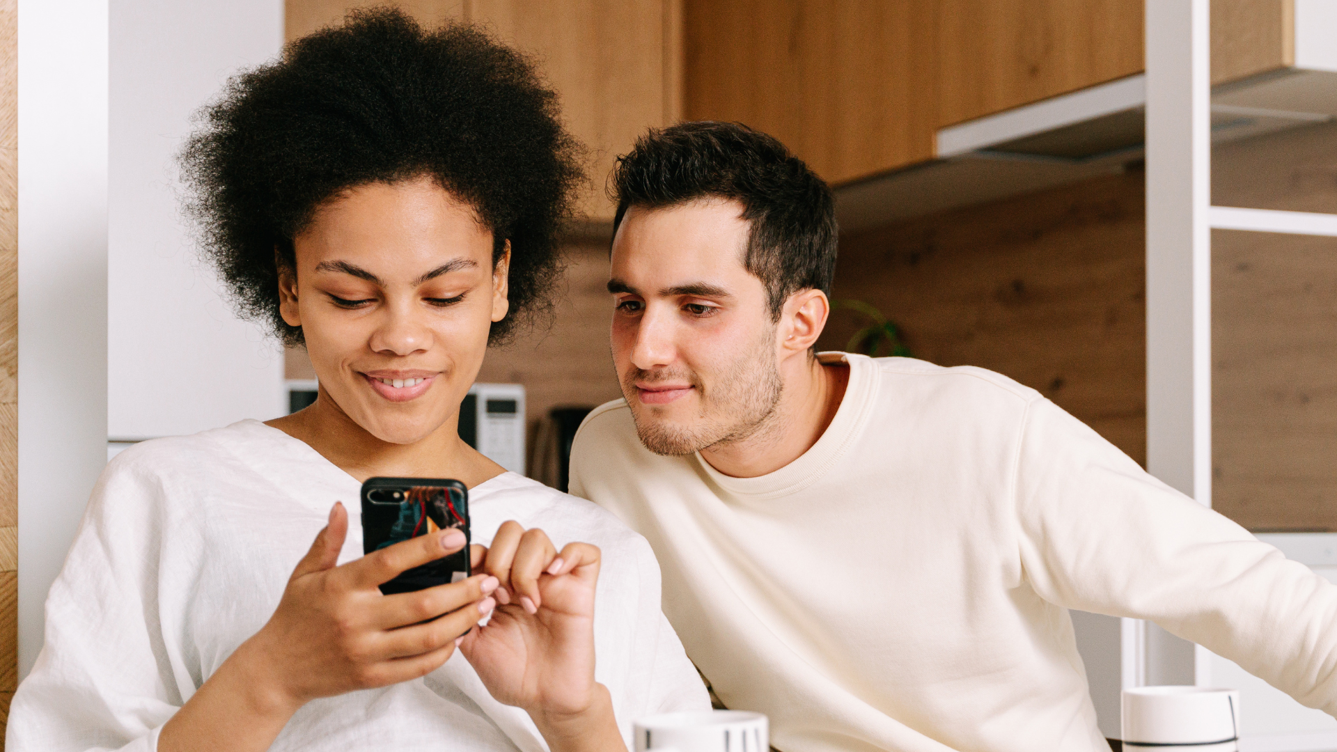 couple using phone to research IVF insurance coverage