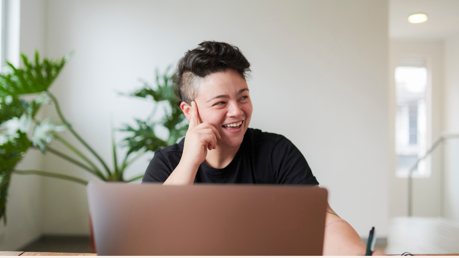 Person smiling at desk