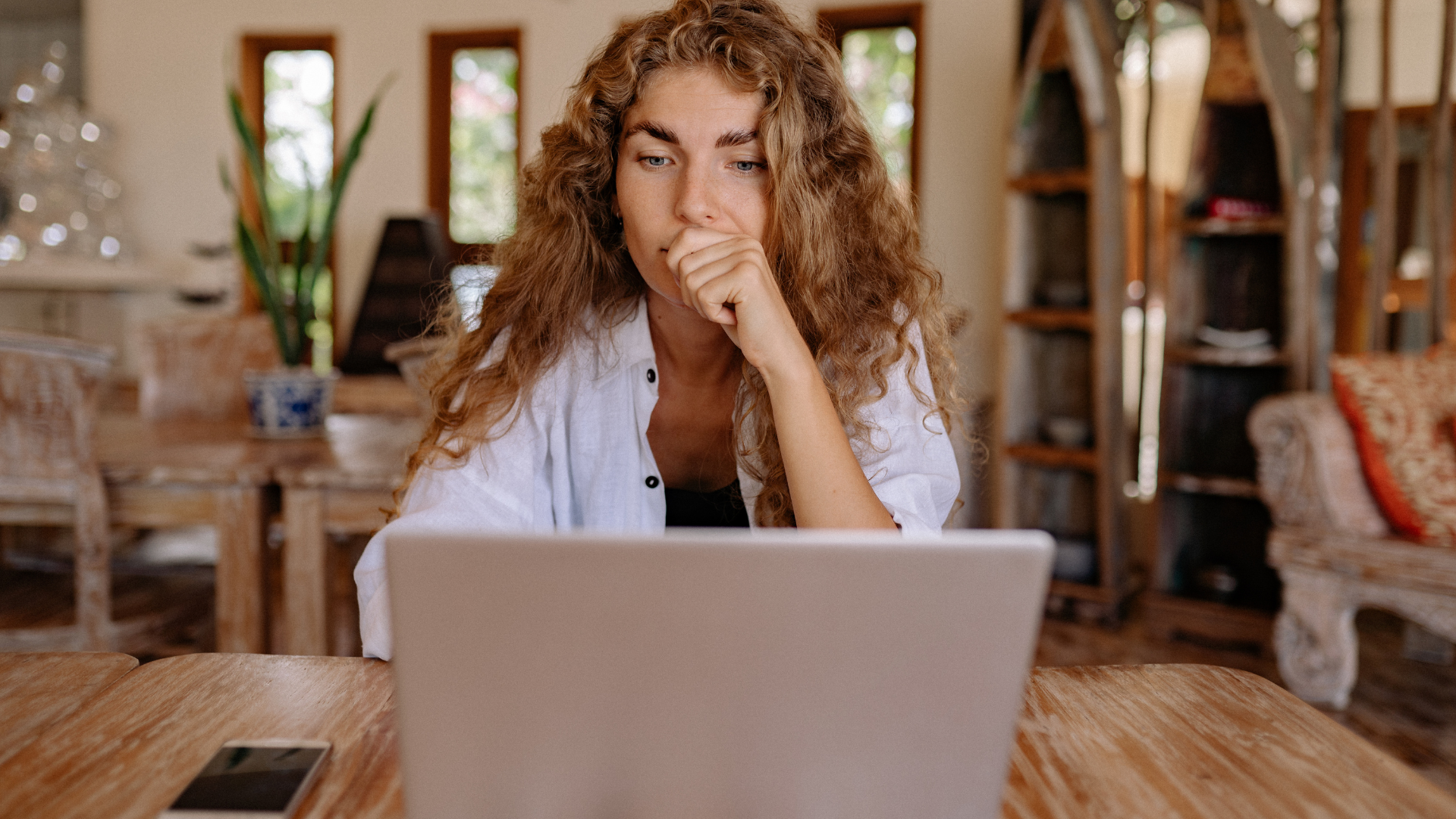 woman using laptop computer to research IVF insurance coverage