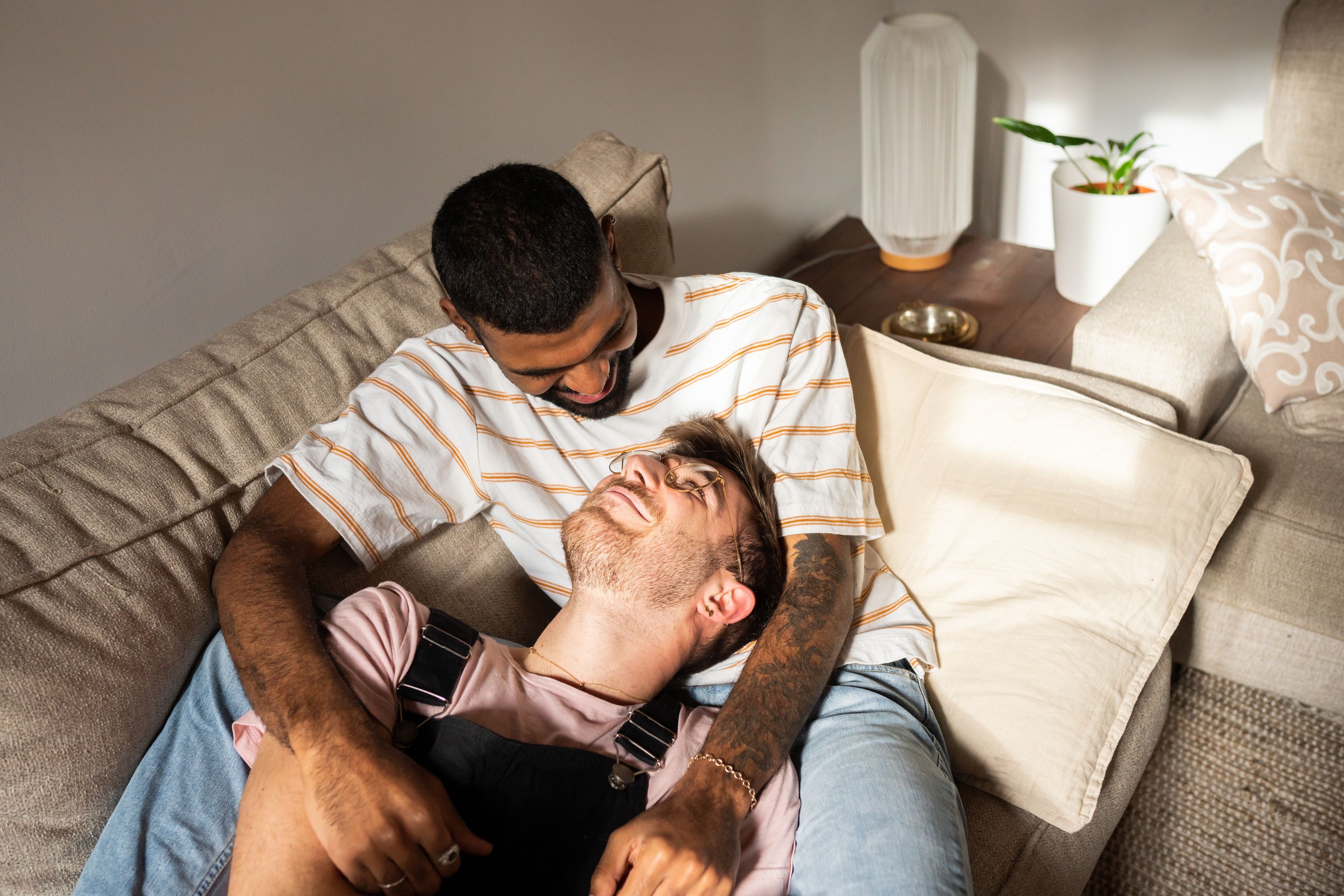 gay male couple relaxing affectionately