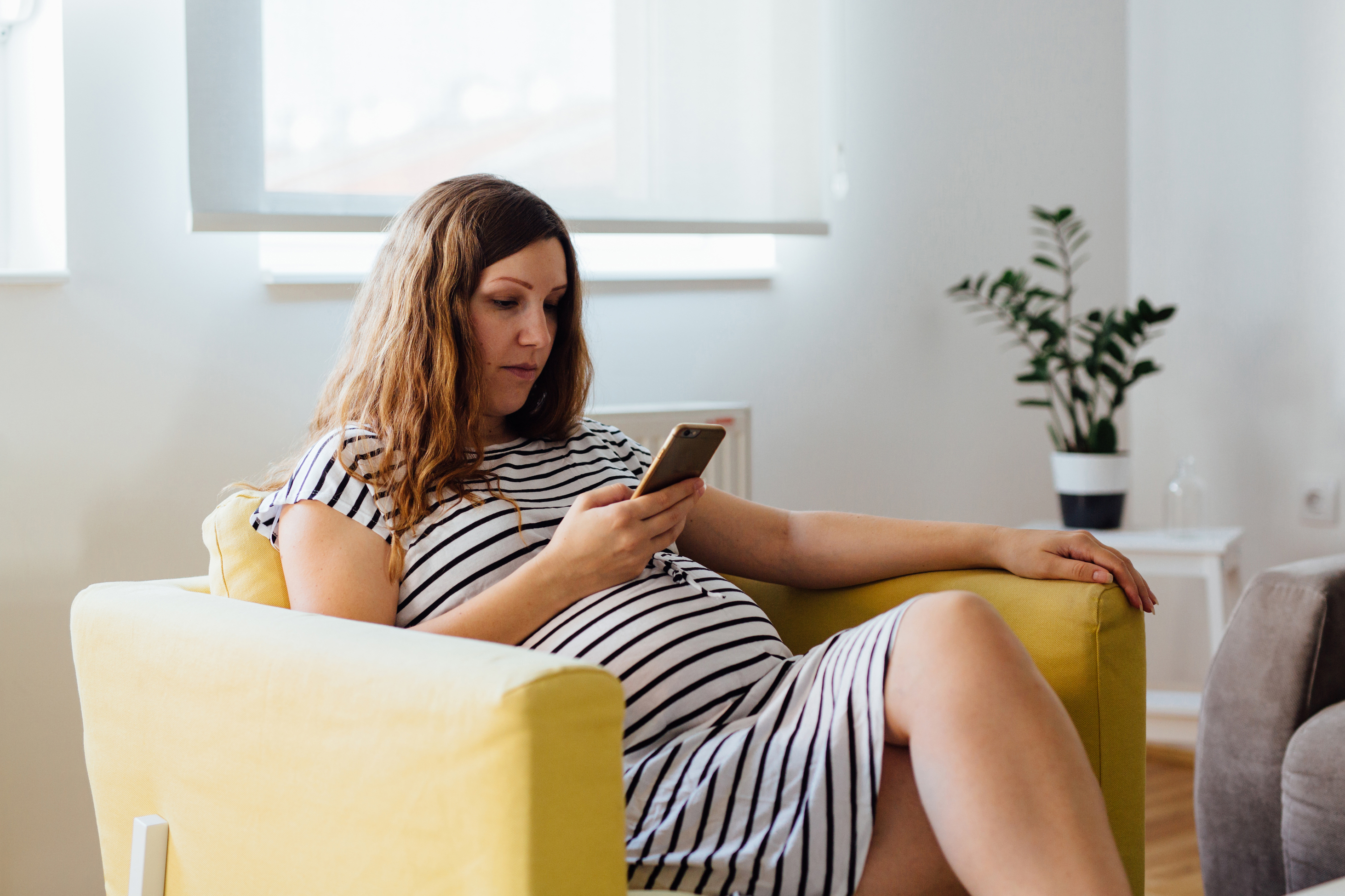 Pregnant woman on phone