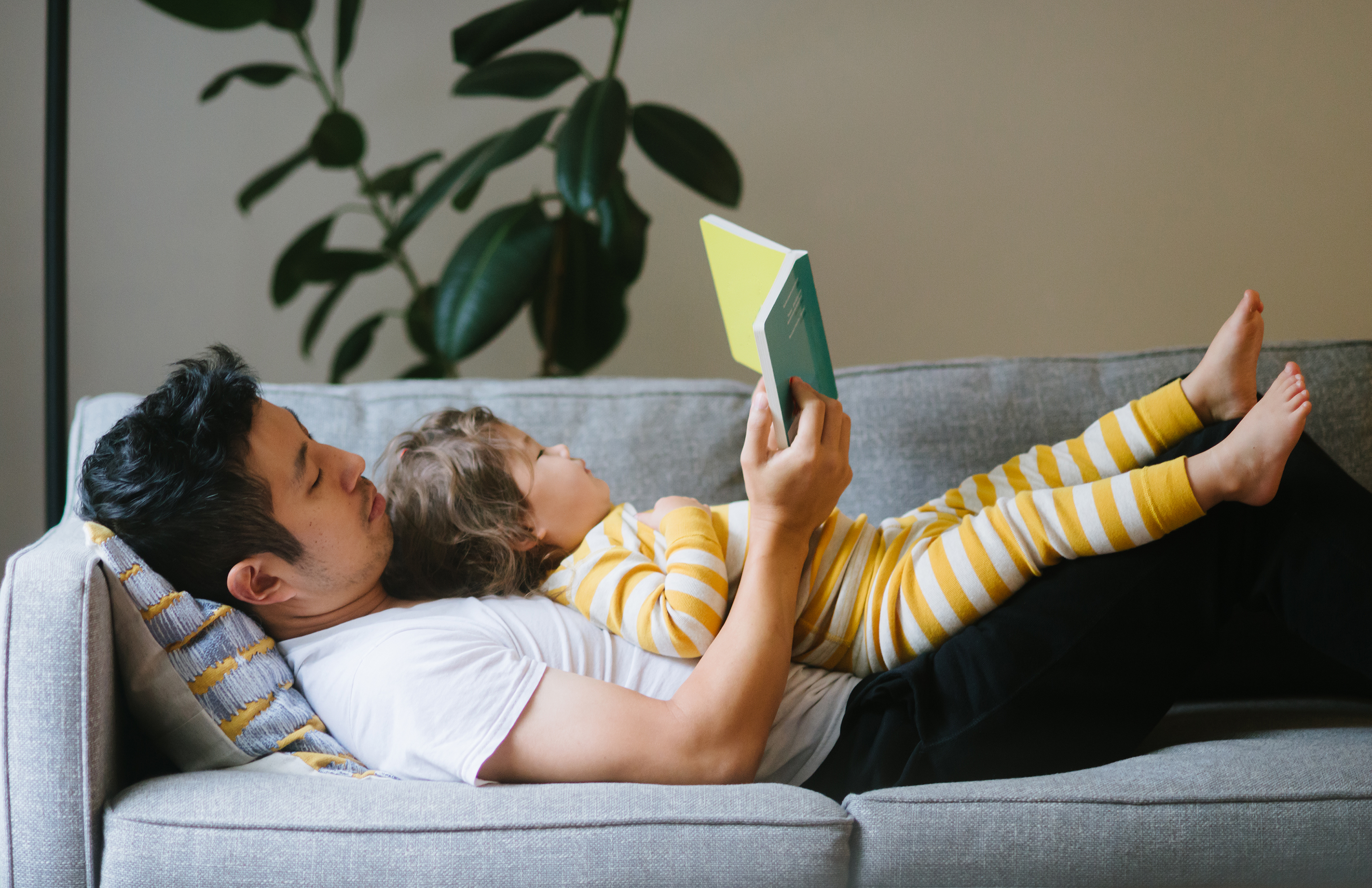 Baby and father reading