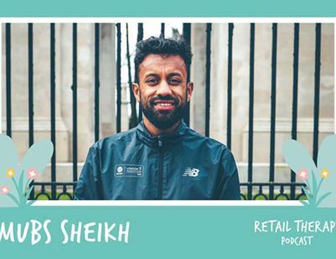 Man in a jacket stands smiling in front of a gated background, with text "Mubs Sheikh" and "Retail Therapy Podcast" on a teal