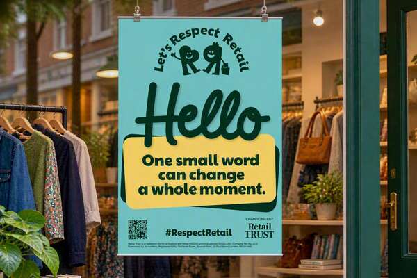 Teal "Respect Retail" banner in a shop window displays "Hello One small word can change a whole moment." Clothes on racks visible inside.