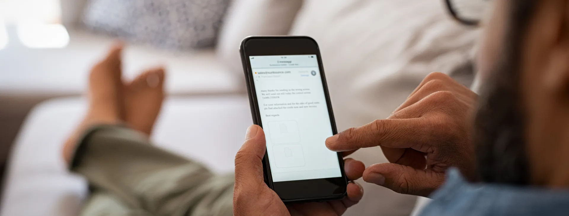 Man checking emails on his phone