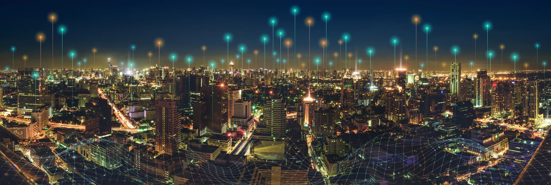 A vibrant city skyline at night with illuminated buildings, glowing points of light that pin point supporters