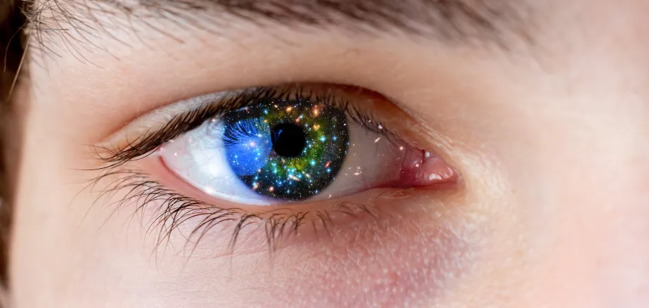 Image of an eye with colourful sparks 