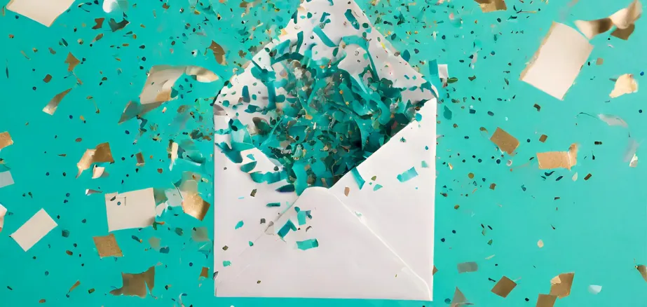 Letter exploding teal confetti