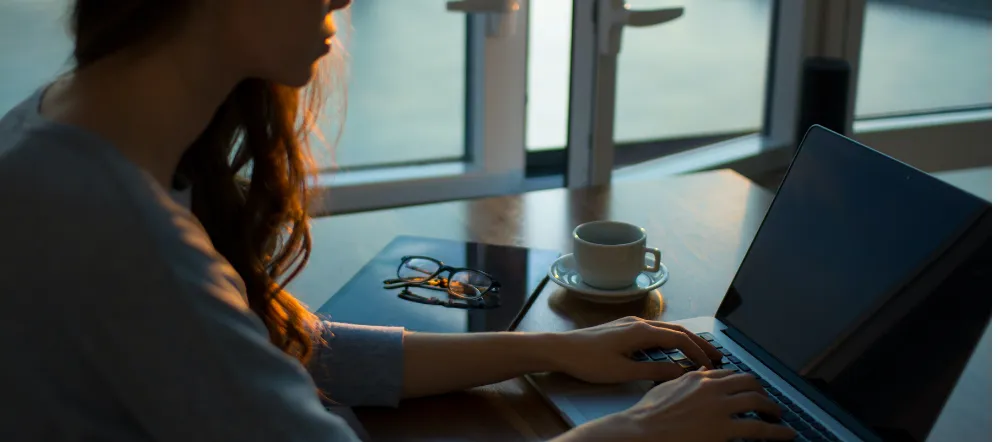 Woman typing on laptop