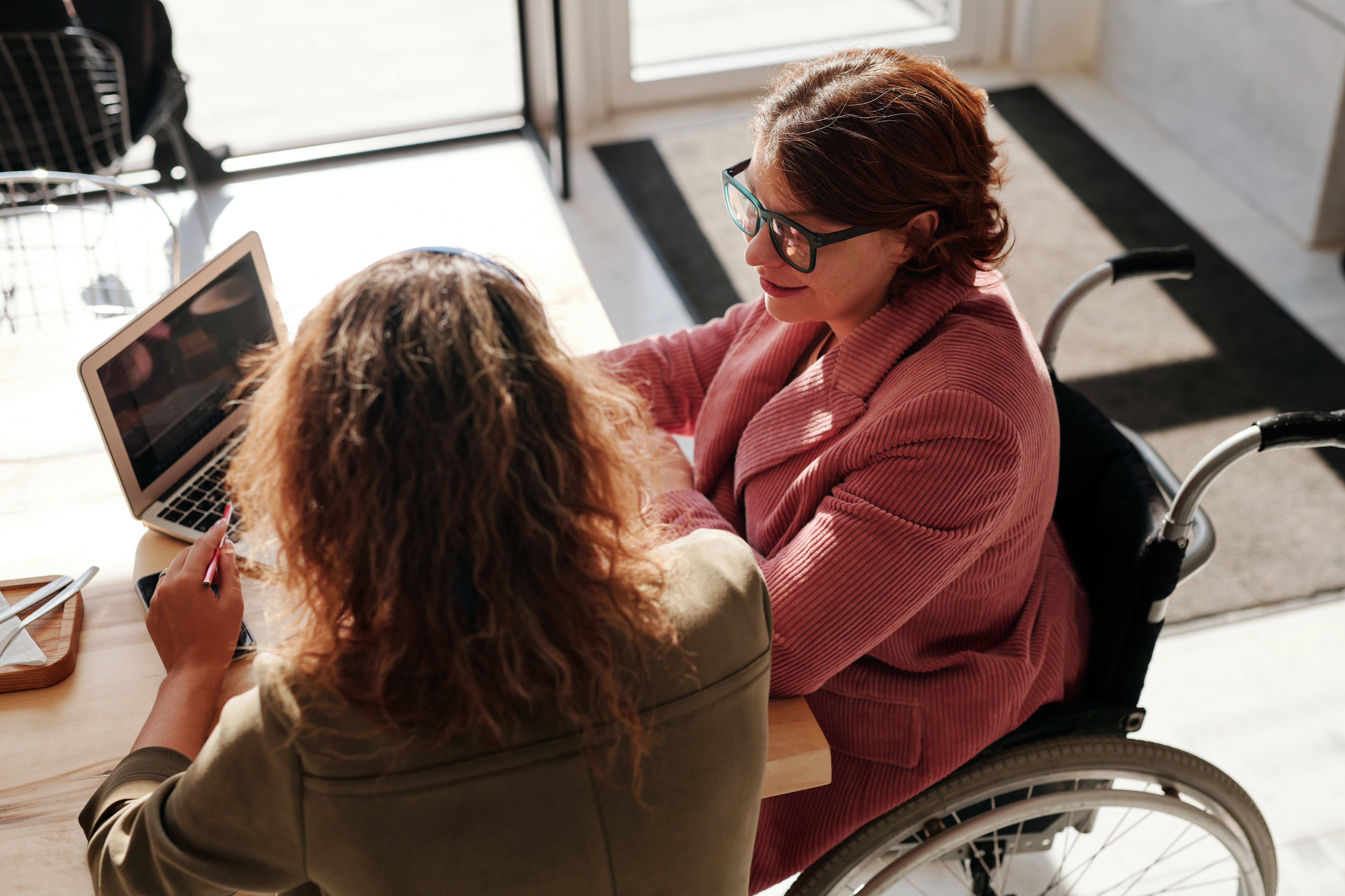 two people working on the computer
