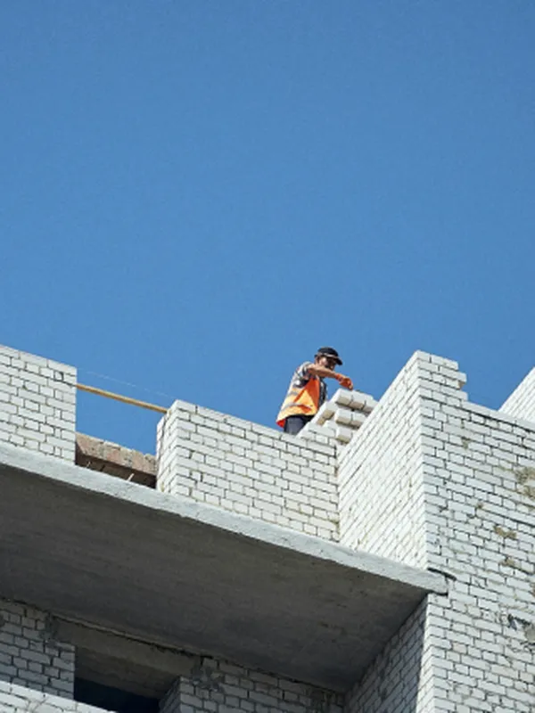 Construction man working on a building