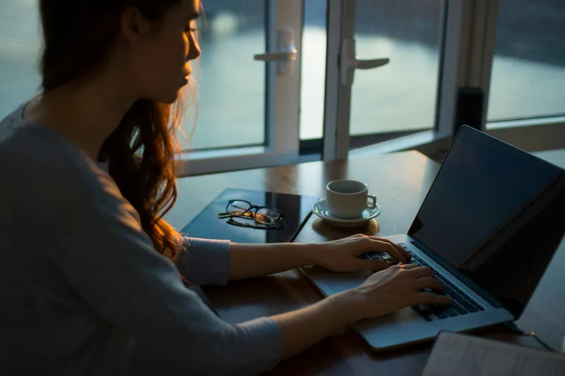 Woman searching on her laptop