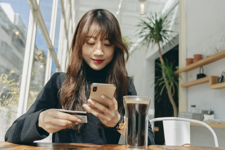 person using fintech banking app on their phone