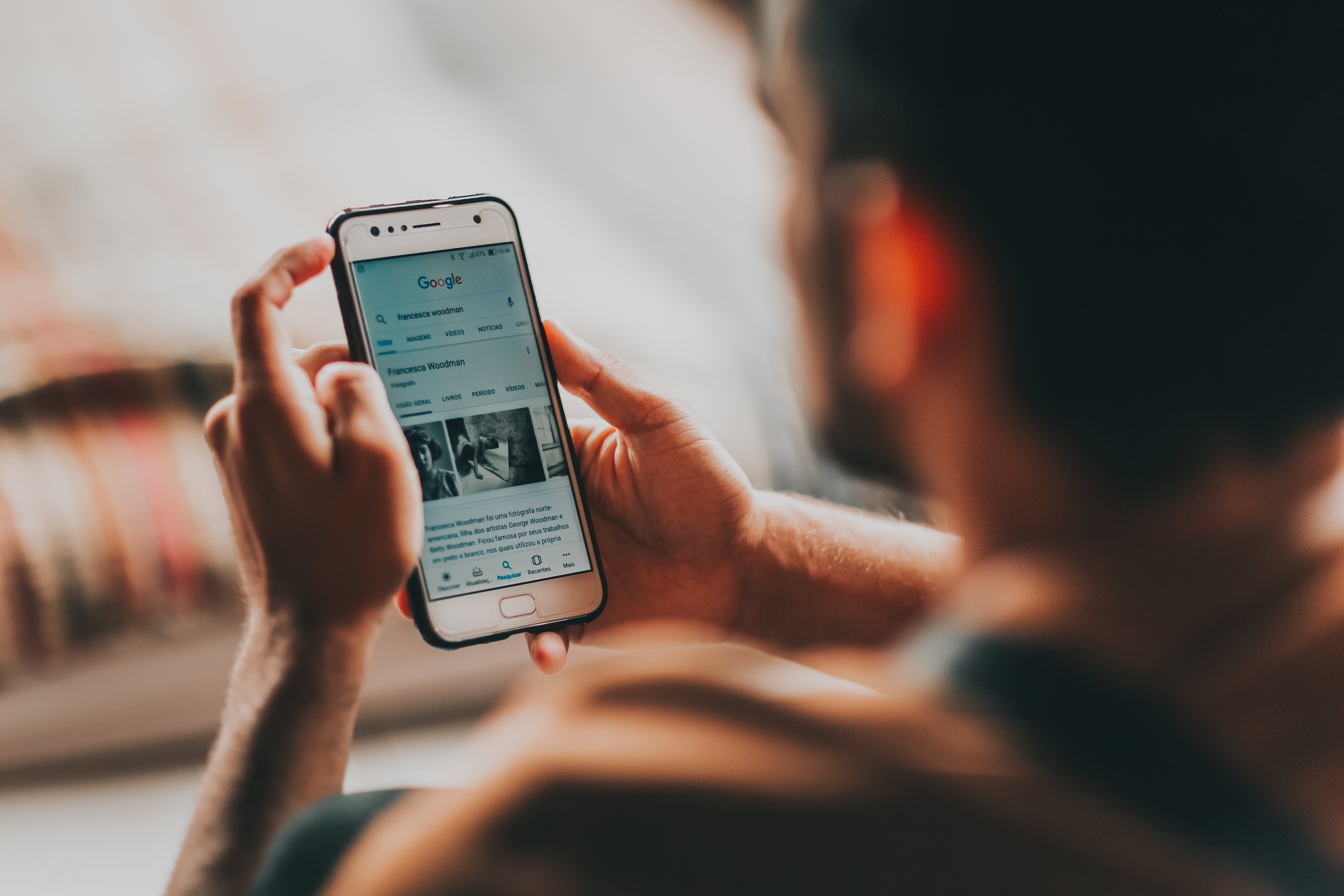 person reading news on their phone