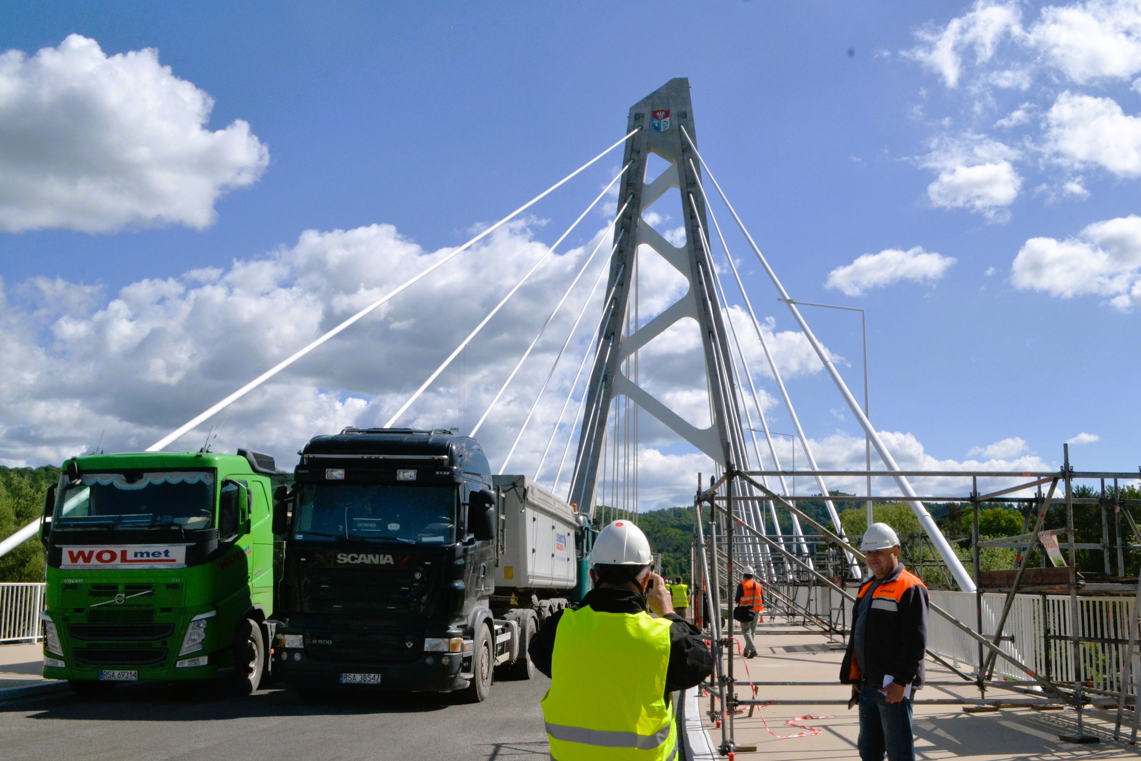 Trucks parked on a new bridge during a load test in Sanok, Poland