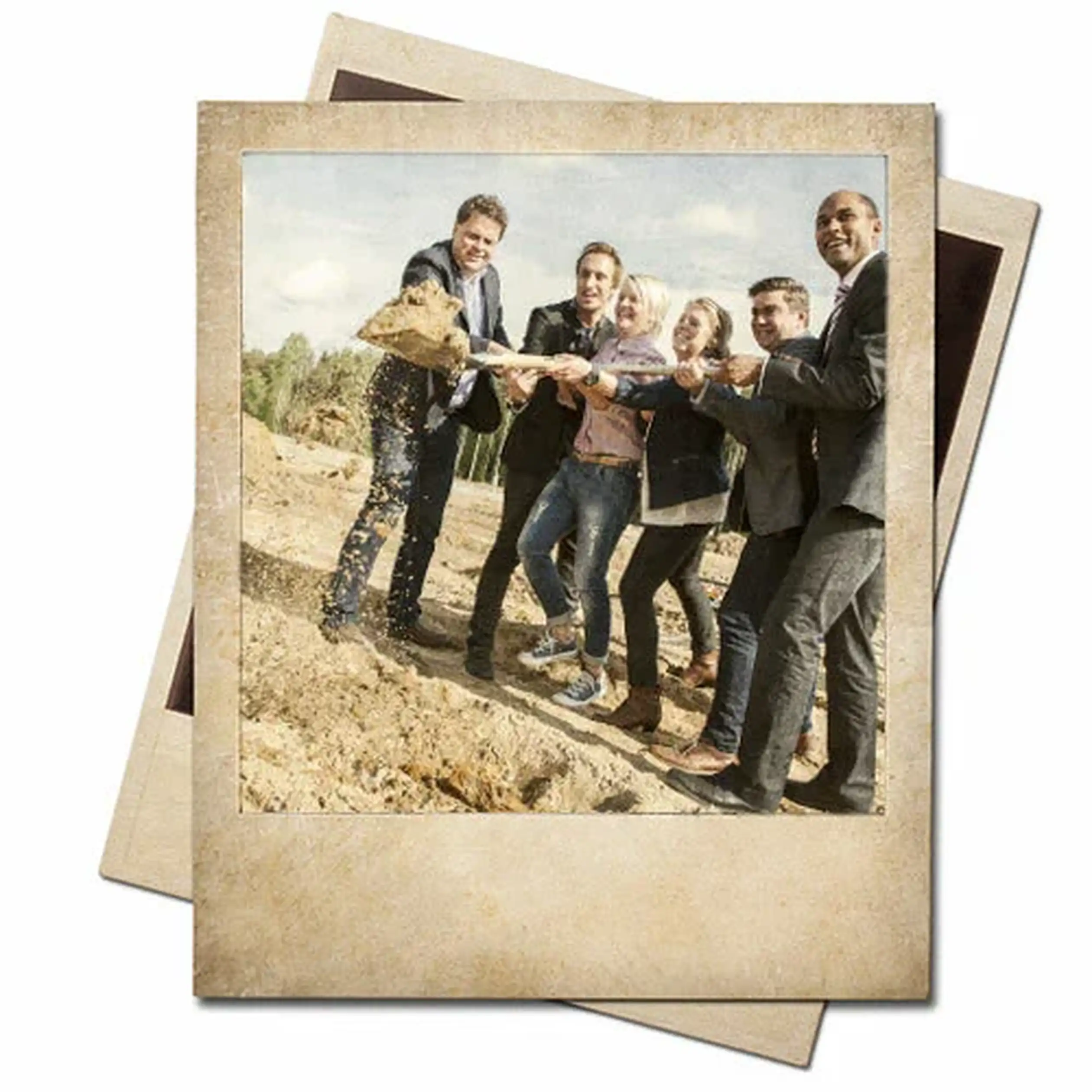 Six people in formal attire joyfully participate in a groundbreaking ceremony, shoveling dirt together at a construction site.