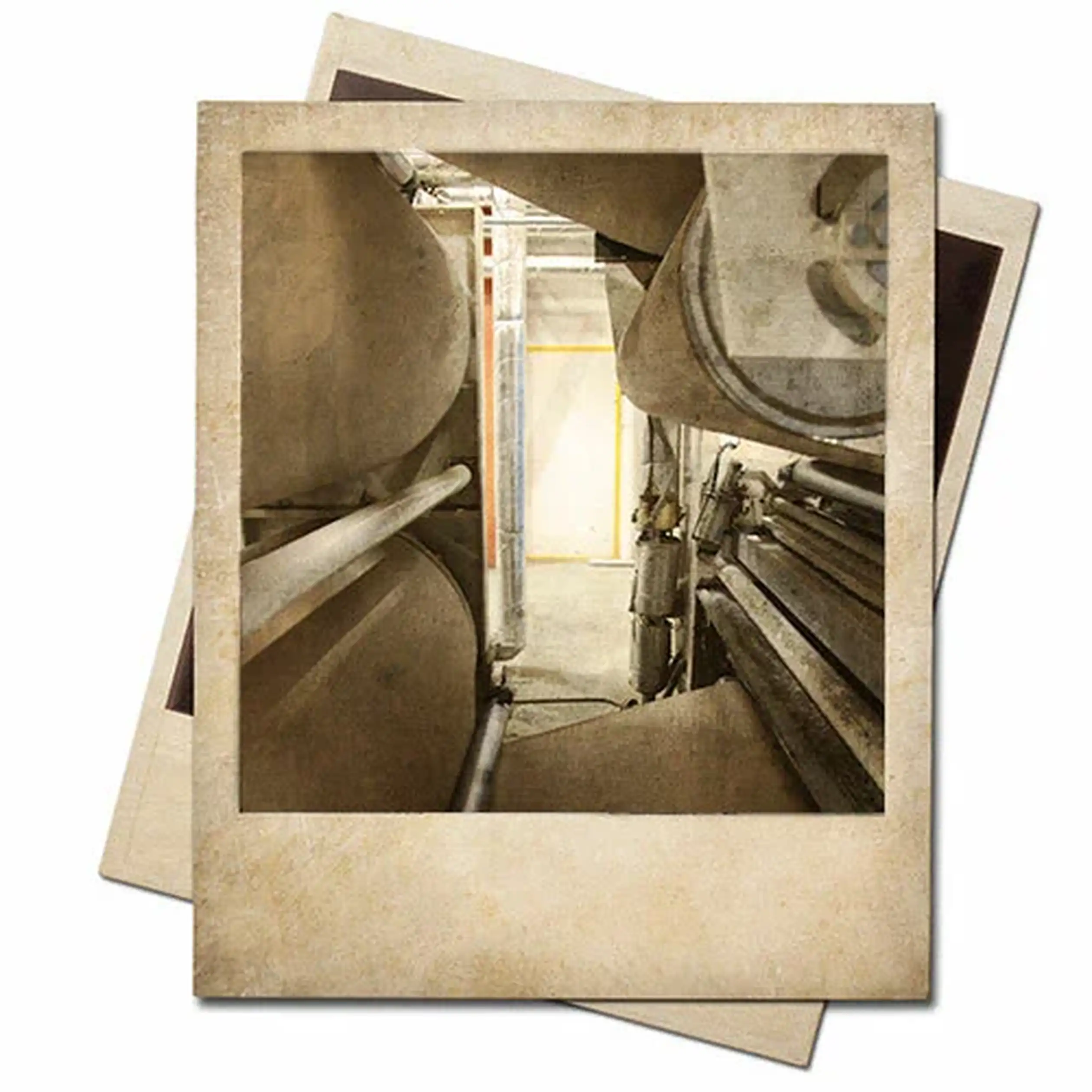 Vintage-style photo of industrial machinery, featuring large metal pipes and tanks in a confined space, with aged photo edges.