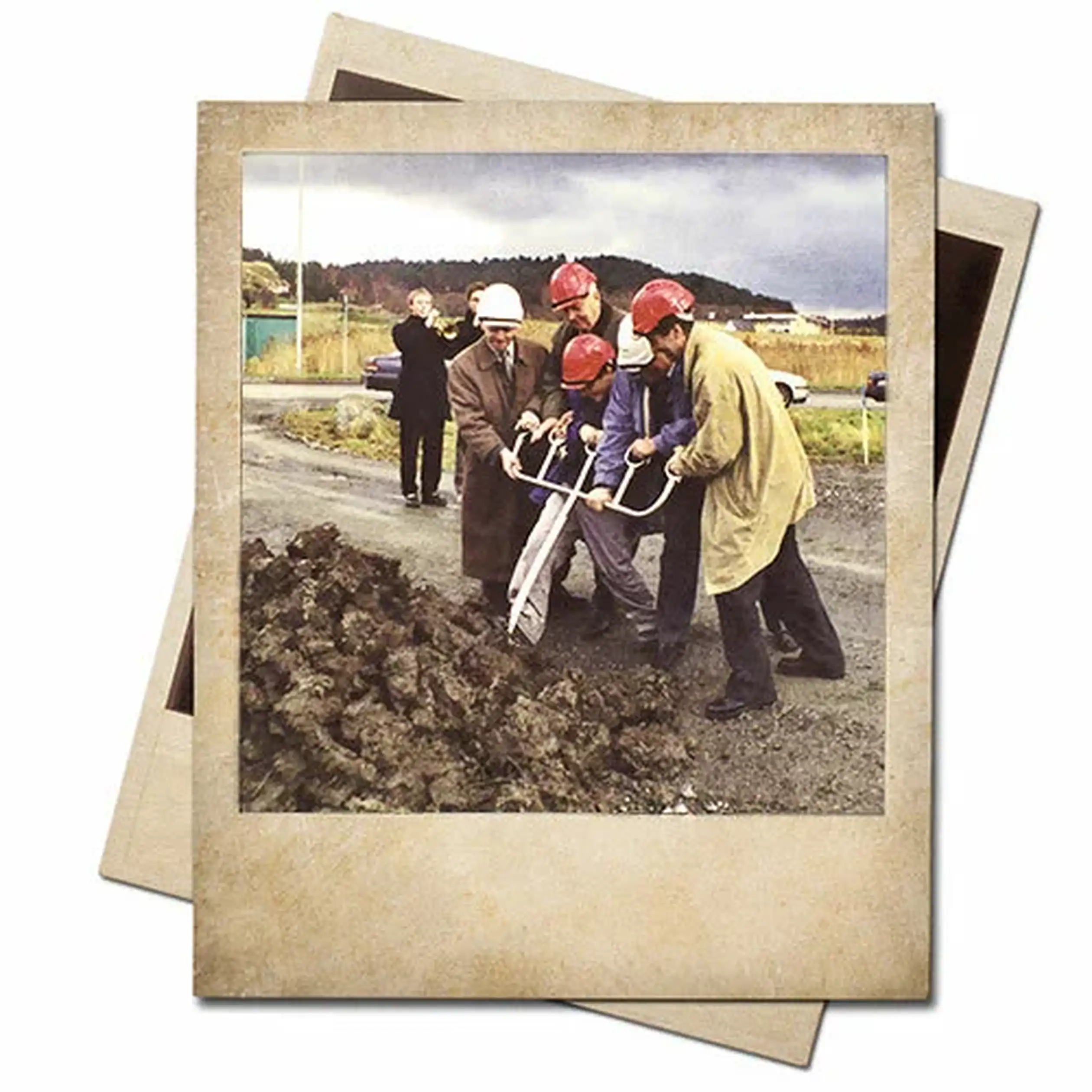 Group of people in helmets using shovels for groundbreaking on dirt, outdoors. One person waves in the background. Vintage photo effect.